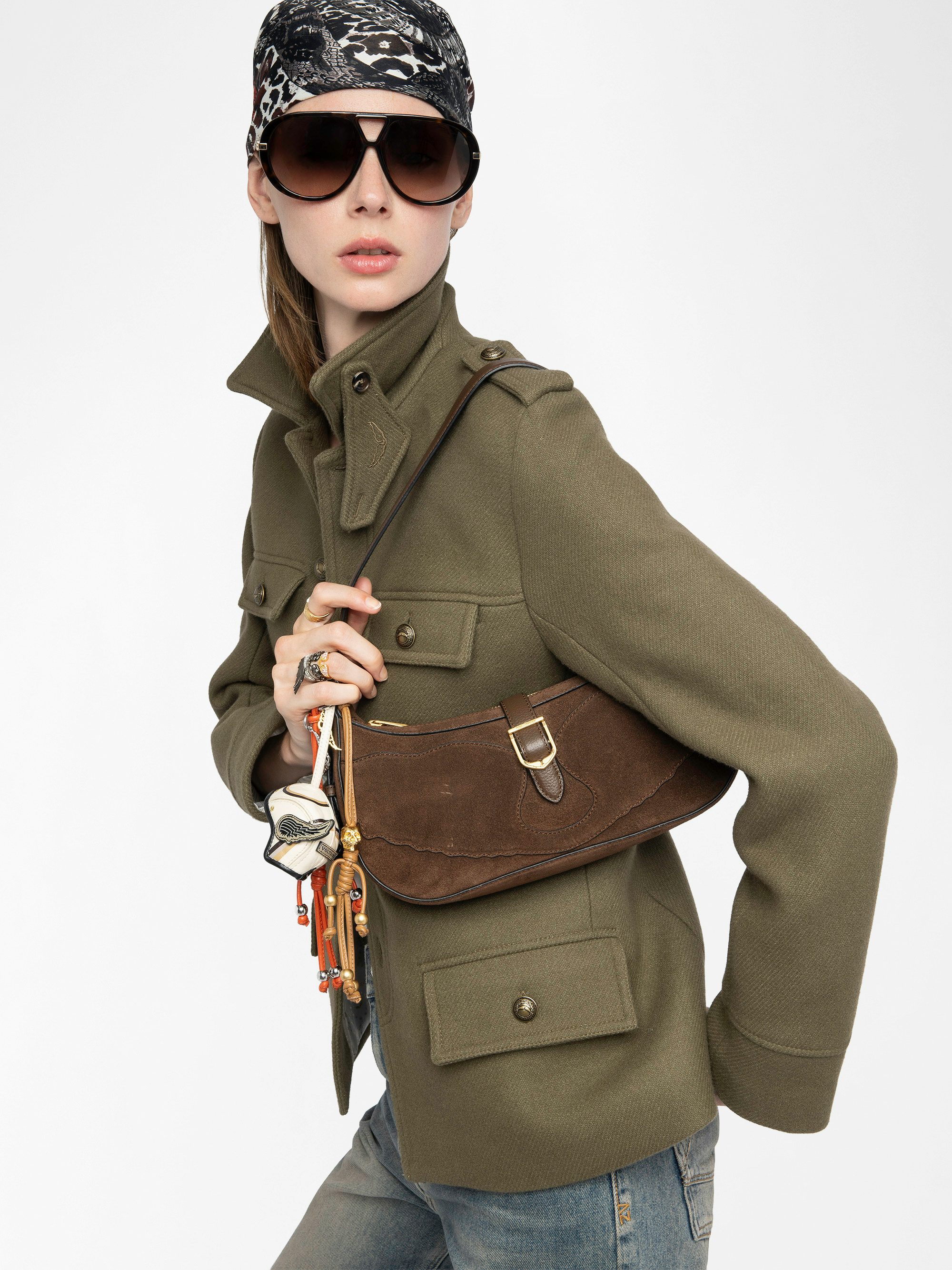 Moonrise Bag - Baguette bag in suede with leather handle and signature wings.